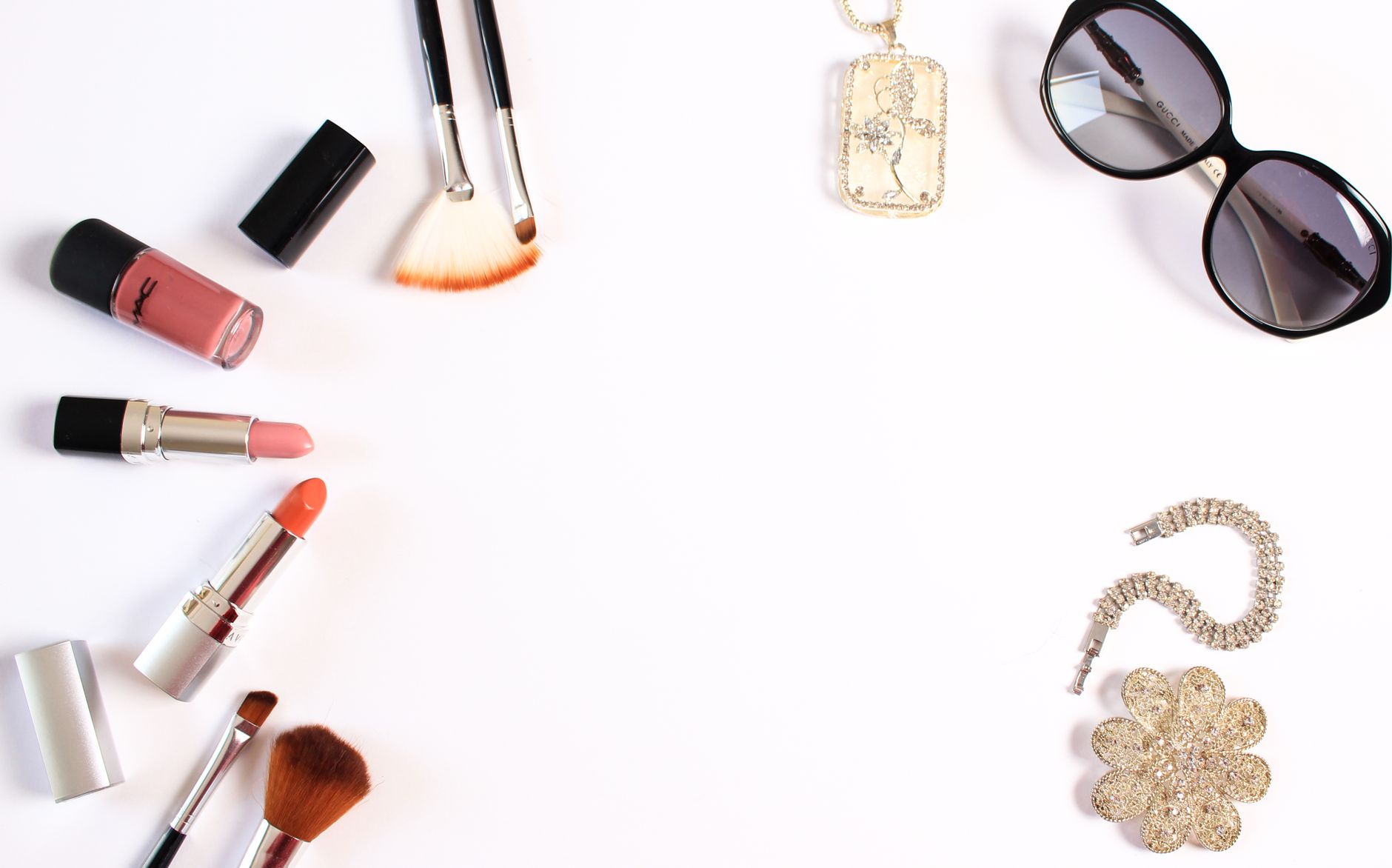 Stylish flat lay of makeup brushes, lipsticks, and glam accessories on a white background. — Exactly why is Small Joint Rebui